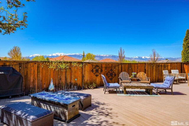 2485 Firenze Dr, Sparks, NV 89434 - deck with area for grilling, a mountain view, and fence