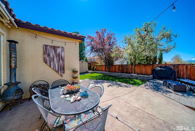 2485 Firenze Dr, Sparks, NV 89434 - view of patio with outdoor dining space, a shed, and an outbuilding