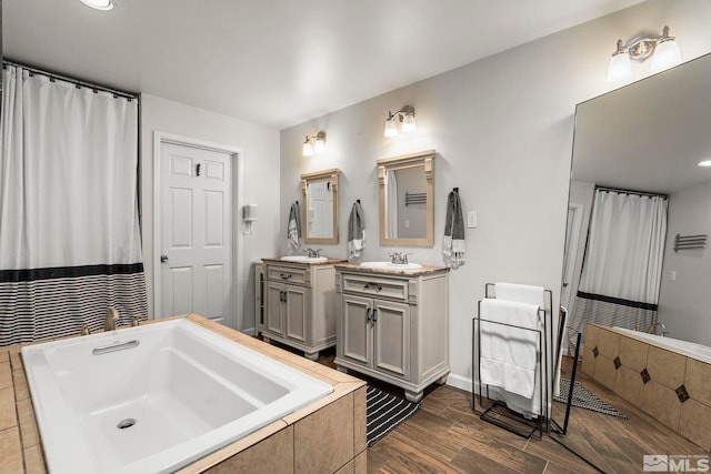 4625 Canyon Dr, Reno, NV 89519 - full bathroom with tiled bath, vanity, wood finished floors, and recessed lighting
