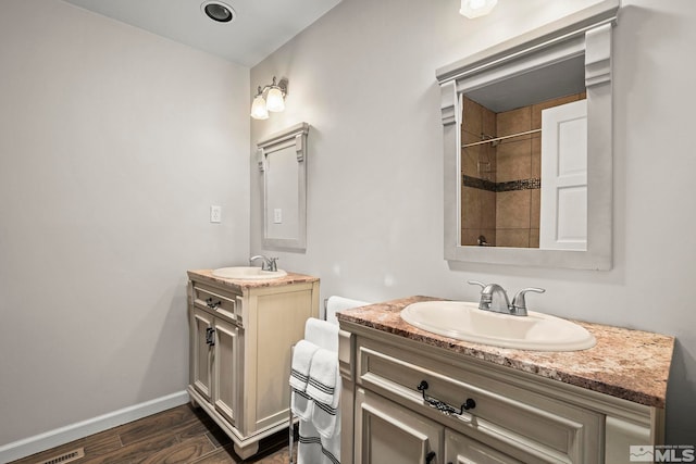 4625 Canyon Dr, Reno, NV 89519 - bathroom with wood finished floors, two vanities, baseboards, and a shower