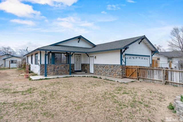 846 Long Valley Rd, Gardnerville, NV 89460 - single story home with an attached garage, stone siding, covered porch, and a shingled roof