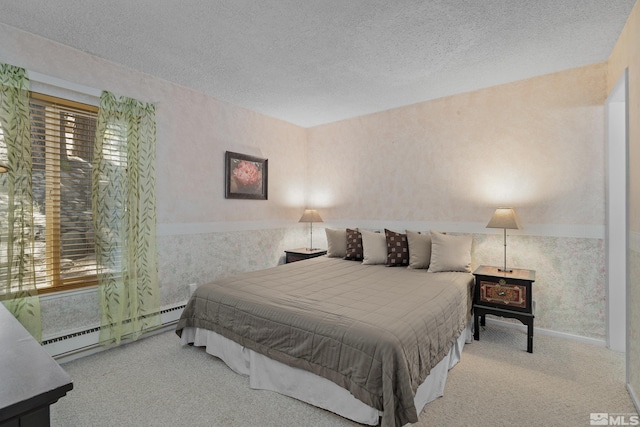 321 Ski Way Unit 148, Incline Village, NV 89451 - carpeted bedroom featuring a baseboard radiator, wallpapered walls, and a textured ceiling