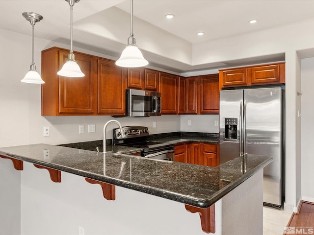 200 W 2nd Unit 1508, Reno, NV 89501 - kitchen with stainless steel appliances, a peninsula, dark stone counters, a breakfast bar, and recessed lighting