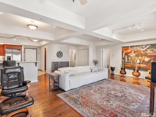 200 W 2nd Unit 1104, Reno, NV 89501 - living room featuring rail lighting, wood finished floors, recessed lighting, and baseboards