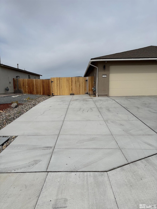 2269 Millville Dr, Sparks, NV 89441 - view of home's exterior with fence and concrete driveway