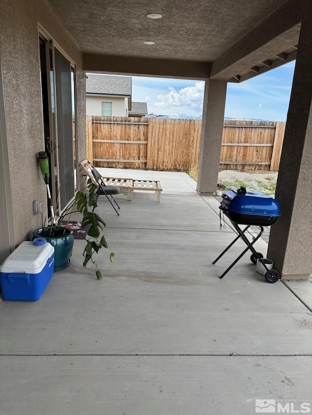 2269 Millville Dr, Sparks, NV 89441 - wooden terrace with a patio, fence, and a grill