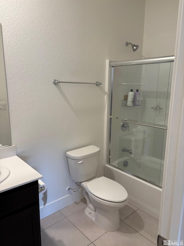 2269 Millville Dr, Sparks, NV 89441 - full bath with toilet, tile patterned floors, shower / bath combination with glass door, vanity, and baseboards