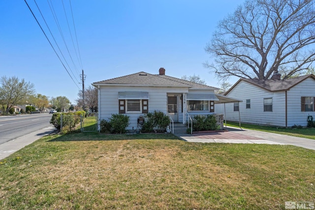 746 6th St, Sparks, NV 89431 - view of front of house featuring a chimney, a front yard, and a gate