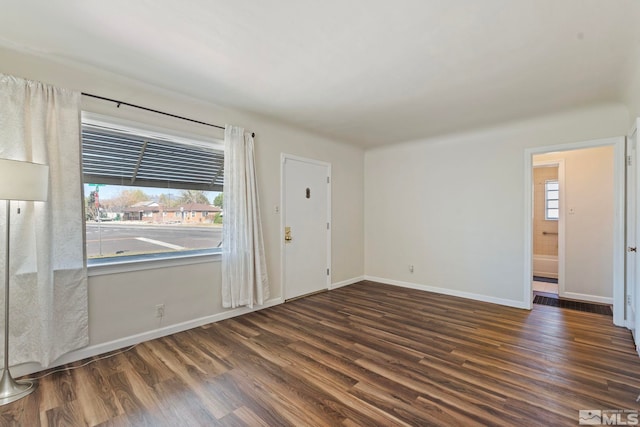 746 6th St, Sparks, NV 89431 - spare room featuring dark wood-style flooring, plenty of natural light, and baseboards