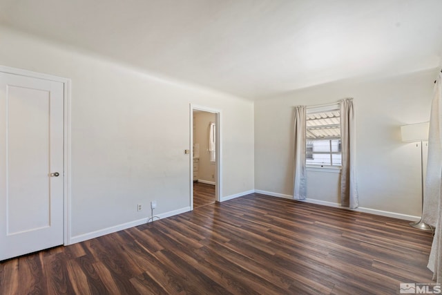 746 6th St, Sparks, NV 89431 - unfurnished bedroom with dark wood finished floors, baseboards, and ensuite bath