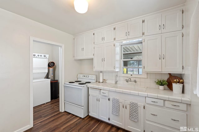 746 6th St, Sparks, NV 89431 - kitchen featuring electric stove, stacked washer / drying machine, white cabinets, and a sink