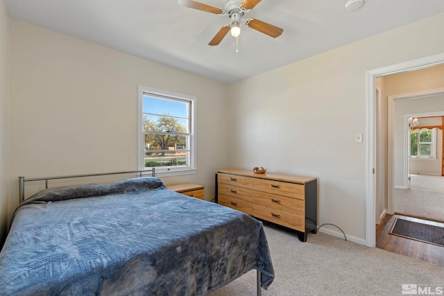 746 6th St, Sparks, NV 89431 - bedroom with light colored carpet, baseboards, and ceiling fan