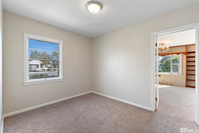 746 6th St, Sparks, NV 89431 - empty room with a chandelier, carpet floors, and baseboards