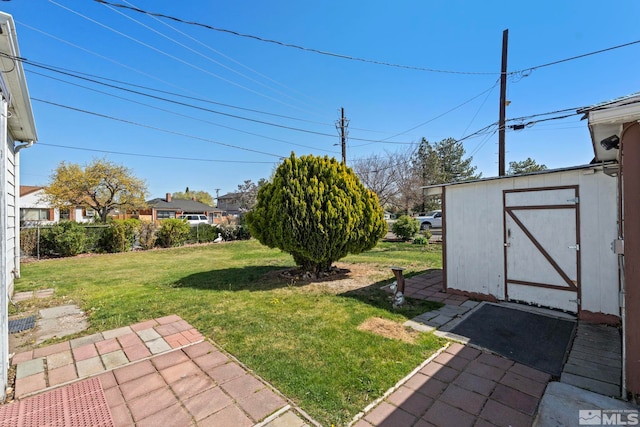 746 6th St, Sparks, NV 89431 - view of grassy yard with a shed, an outbuilding, and a patio area