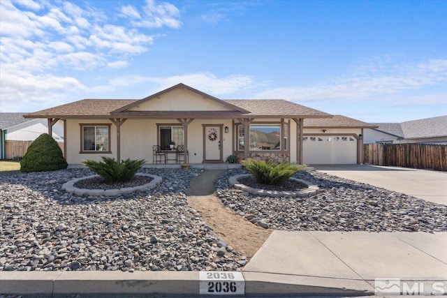 2036 Flycatcher Ct, Sparks, NV 89441 - single story home with fence, concrete driveway, covered porch, and a garage