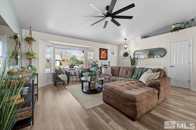 2036 Flycatcher Ct, Sparks, NV 89441 - living room with lofted ceiling, a ceiling fan, light wood-type flooring, and baseboards