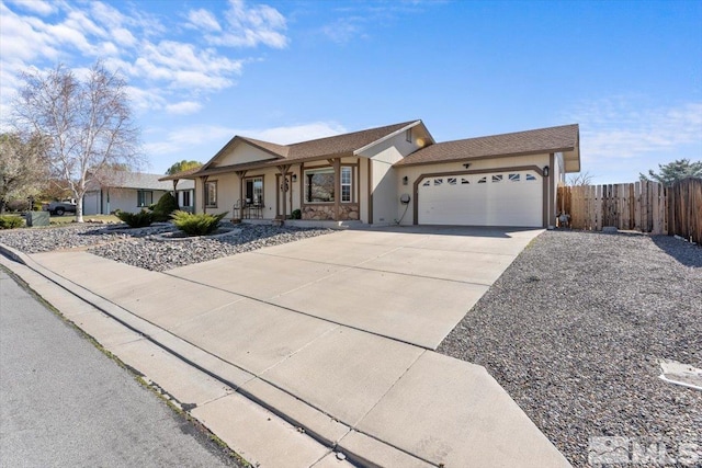 2036 Flycatcher Ct, Sparks, NV 89441 - single story home featuring fence, a garage, stucco siding, driveway, and covered porch
