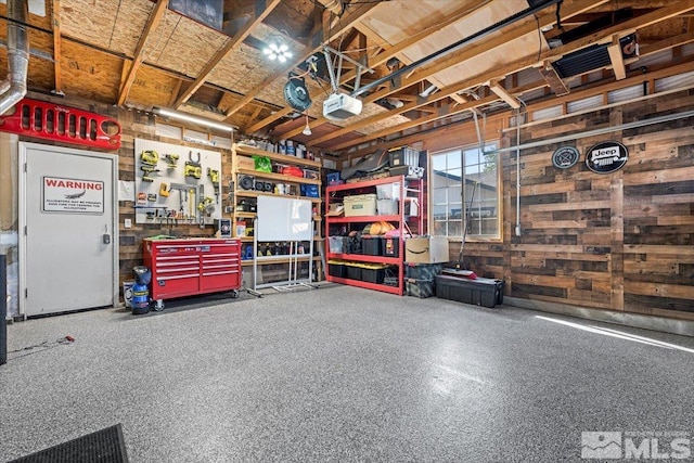 2036 Flycatcher Ct, Sparks, NV 89441 - garage featuring a garage door opener and wood walls