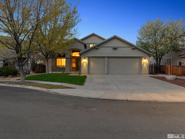 3240 Dunbar Ct, Sparks, NV 89436 - view of front of house with an attached garage, concrete driveway, and stucco siding