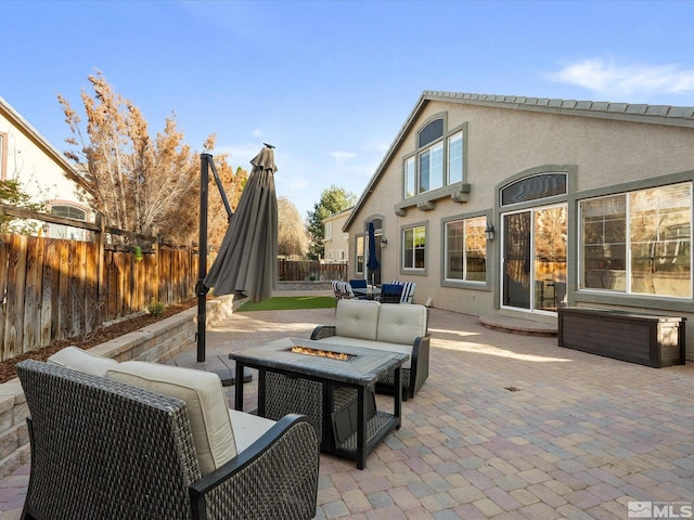 3240 Dunbar Ct, Sparks, NV 89436 - view of patio with a fenced backyard and an outdoor living space with a fire pit