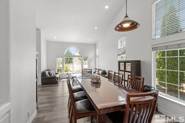 2525 Beaumont Pkwy, Reno, NV 89523 - dining area with high vaulted ceiling, wood finished floors, recessed lighting, and baseboards