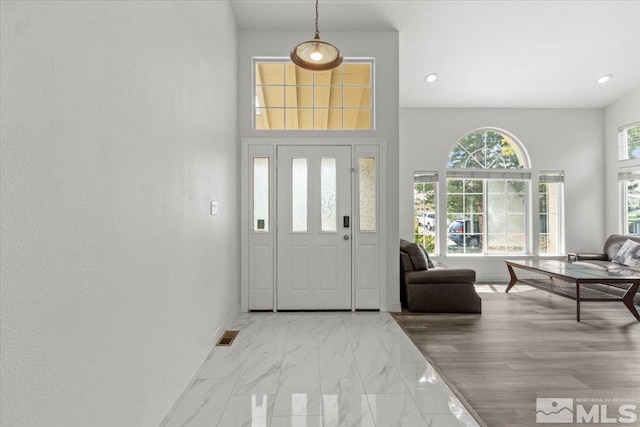 2525 Beaumont Pkwy, Reno, NV 89523 - foyer entrance with light marble finish floors, baseboards, recessed lighting, and a towering ceiling