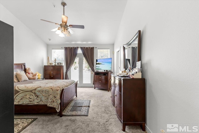 2525 Beaumont Pkwy, Reno, NV 89523 - bedroom featuring access to exterior, light carpet, lofted ceiling, and a ceiling fan