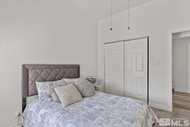 2525 Beaumont Pkwy, Reno, NV 89523 - carpeted bedroom with a closet, baseboards, and lofted ceiling