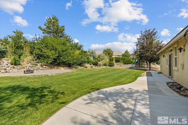 2525 Beaumont Pkwy, Reno, NV 89523 - view of green lawn with a playground
