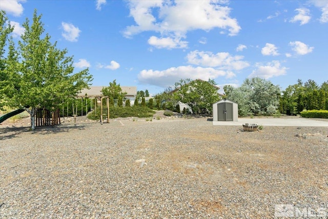 2525 Beaumont Pkwy, Reno, NV 89523 - view of yard with a storage shed and an outbuilding