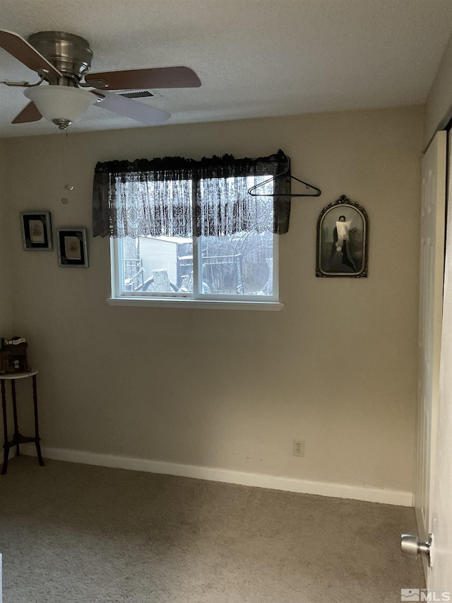 3645 Peregrine Cir, Reno, NV 89508 - spare room with a ceiling fan, carpet floors, and baseboards
