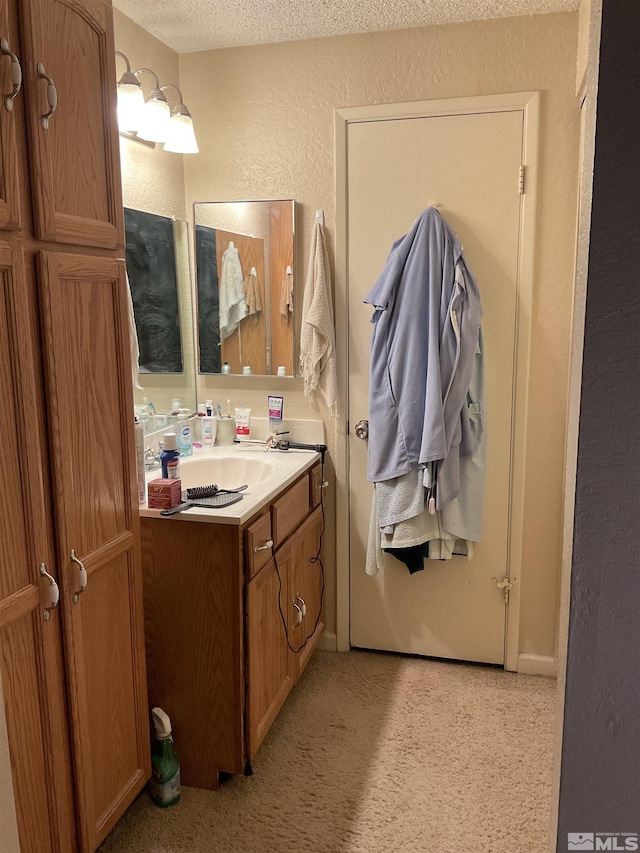 3645 Peregrine Cir, Reno, NV 89508 - bathroom featuring a textured wall and vanity