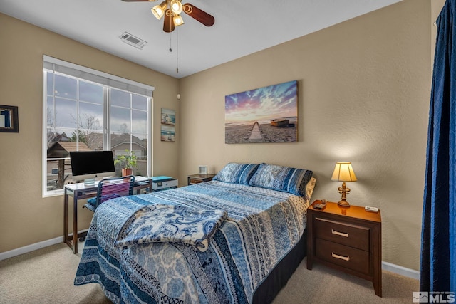 bedroom with carpet, baseboards, and ceiling fan