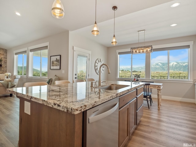 5376 S Edmonds Dr, Carson City, NV 89701 - kitchen featuring stainless steel dishwasher, a sink, healthy amount of natural light, light wood-style floors, and recessed lighting