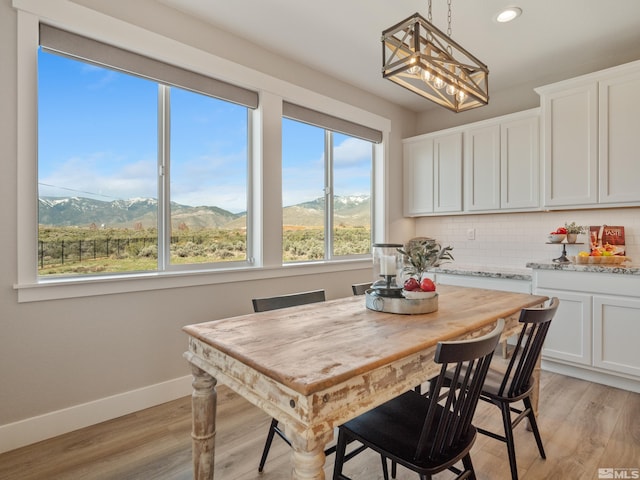 5376 S Edmonds Dr, Carson City, NV 89701 - dining room featuring baseboards, a chandelier, light wood-style floors, a mountain view, and recessed lighting