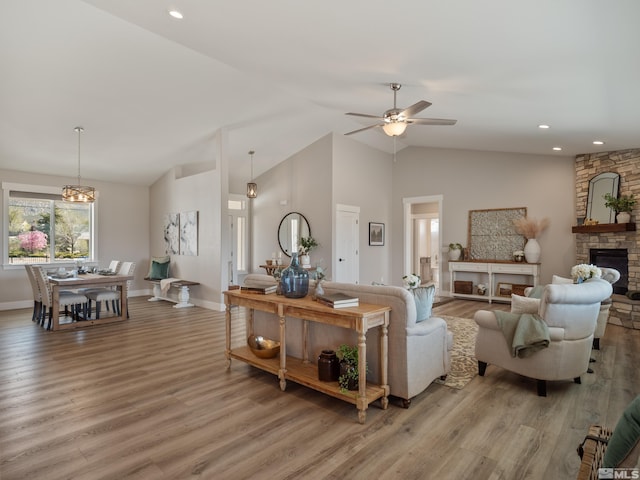 5376 S Edmonds Dr, Carson City, NV 89701 - living room featuring ceiling fan, light wood-style floors, a fireplace, baseboards, and recessed lighting