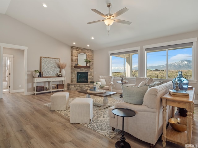 5376 S Edmonds Dr, Carson City, NV 89701 - living area with vaulted ceiling, wood finished floors, a ceiling fan, a mountain view, and recessed lighting