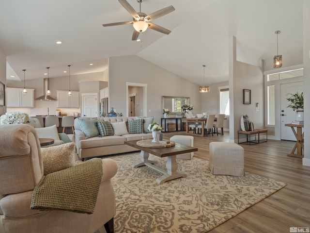 5376 S Edmonds Dr, Carson City, NV 89701 - living room with wood finished floors, high vaulted ceiling, a ceiling fan, and baseboards
