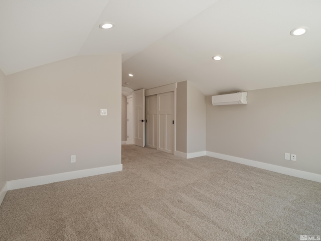 5376 S Edmonds Dr, Carson City, NV 89701 - bonus room featuring a wall mounted AC, light colored carpet, vaulted ceiling, recessed lighting, and baseboards