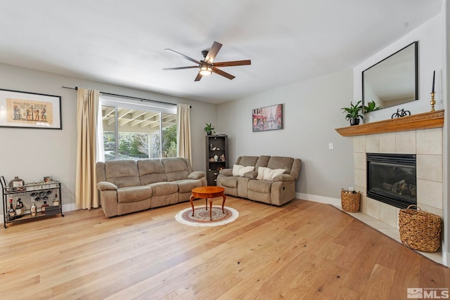 5989 Hidden Highlands Dr, Reno, NV 89502 - living area with ceiling fan, light wood-type flooring, a fireplace, and baseboards