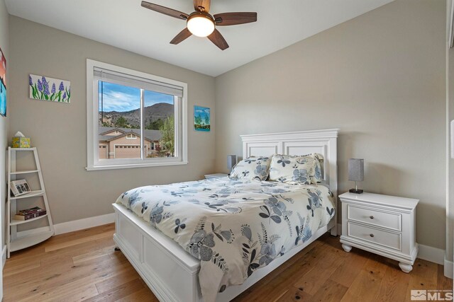 5989 Hidden Highlands Dr, Reno, NV 89502 - bedroom featuring light wood-type flooring, baseboards, and a ceiling fan