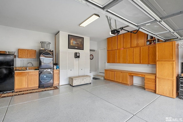 5989 Hidden Highlands Dr, Reno, NV 89502 - garage with freestanding refrigerator, stacked washer / drying machine, a desk, a garage door opener, and a sink