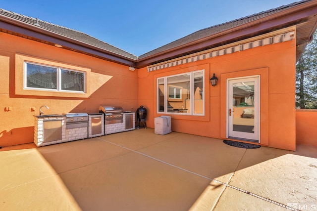 2501 Kensington Pl, Carson City, NV 89703 - view of patio featuring exterior kitchen, a grill, and a sink
