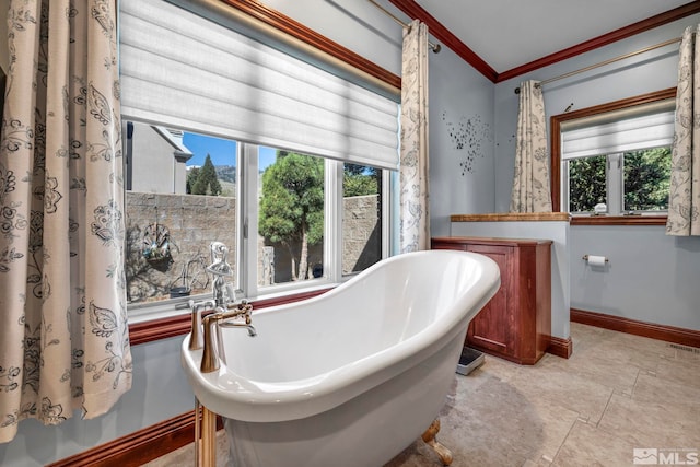 2501 Kensington Pl, Carson City, NV 89703 - bathroom featuring crown molding, baseboards, and a freestanding tub