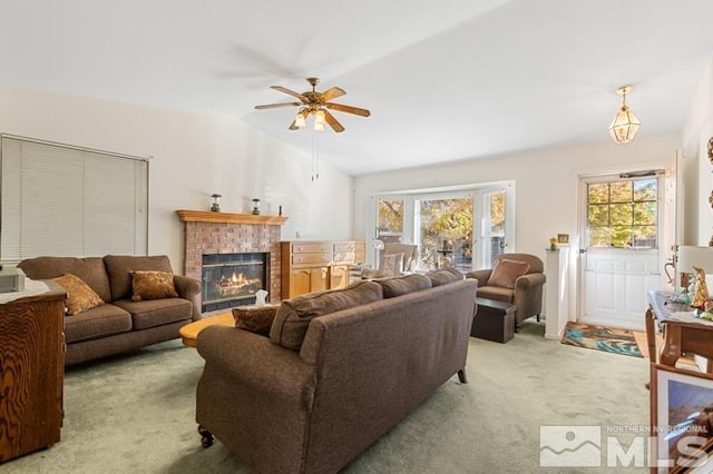 248 Woodlake Cir, Dayton, NV 89403 - living area with carpet flooring, plenty of natural light, ceiling fan, a brick fireplace, and lofted ceiling