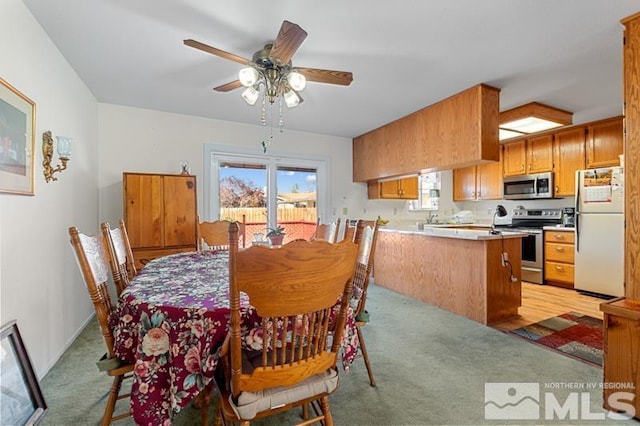 248 Woodlake Cir, Dayton, NV 89403 - dining area featuring light colored carpet and ceiling fan