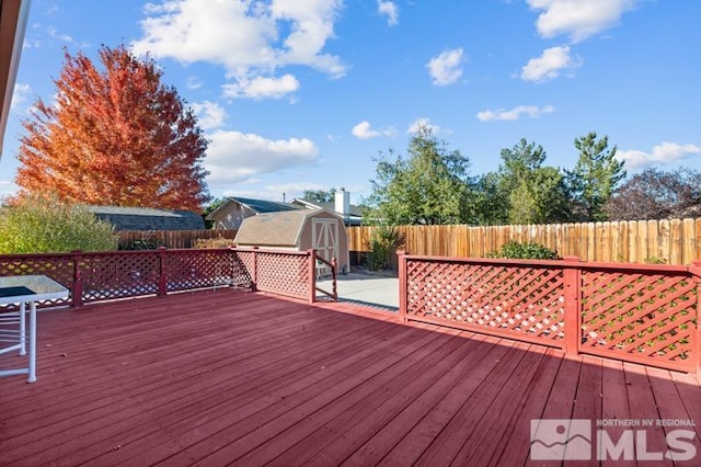 248 Woodlake Cir, Dayton, NV 89403 - wooden terrace featuring a storage shed, a fenced backyard, and an outdoor structure