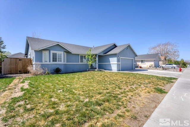 989 Julia Ln, Fernley, NV 89408 - single story home with concrete driveway, stucco siding, an attached garage, and a shingled roof