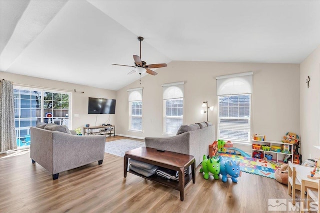 989 Julia Ln, Fernley, NV 89408 - living room with a ceiling fan, wood finished floors, and lofted ceiling