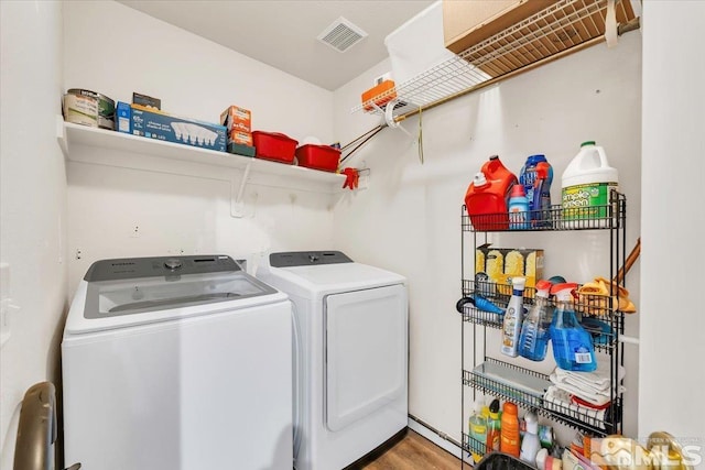 989 Julia Ln, Fernley, NV 89408 - laundry room featuring washing machine and clothes dryer and wood finished floors